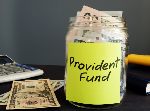 provident fund written on jar full of money