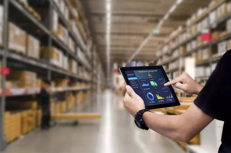Warehouse management system dashboard displayed on a tablet.